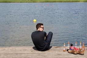 empty bottles of alcohol on the pier