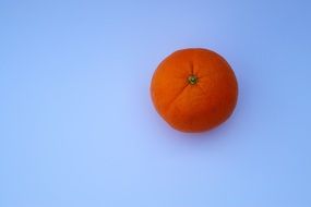 orange mandarin on a blue background