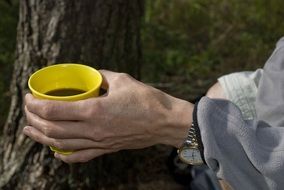 glass with a coffee in hand