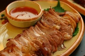 smoked duck with sauce on a plate