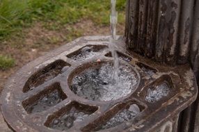 Water flows along a metal grate