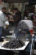 mussels under the sprinkler in the market