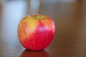 Colorful apple on the table