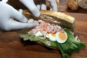 Sandwich with the egg, prawns and vegetables