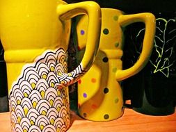 yellow ceramic cups with a pattern