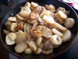 Frying potatoes in the frying pan