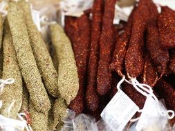 different sausages with spices close-up