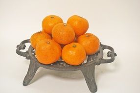 tangerines on an openwork stand