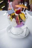 colored ice cream with fruit in a glass