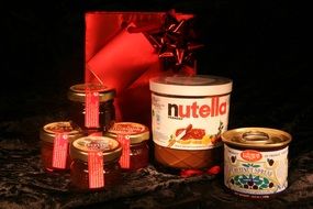 nutella and jam jars in gift wrapping