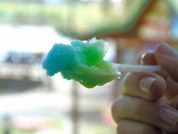 colorful ice cream in a plastic spoon