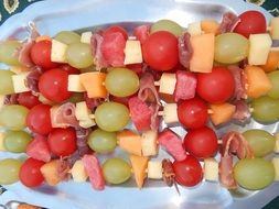 Fruits and meat on a skewers