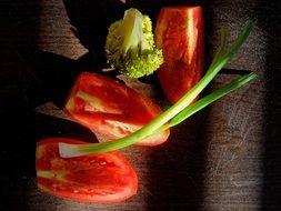 Cut healthy tomatoes,onions and broccolies