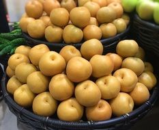 yellow round pears in a market