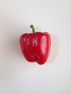 ripe red pepper on a white background