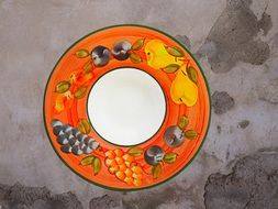 painted beautiful plate on a gray background