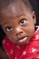 black kid with huge eyes