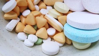 pills of different shapes in a plate