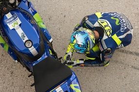 racer near the motorcycle