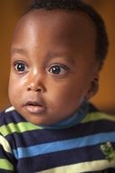 serious child with dark skin