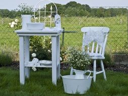 White table and chair in a garden