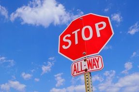 red stop sign against the sky