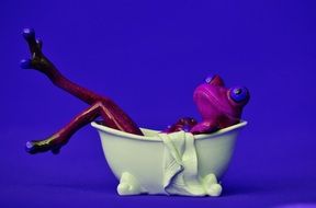 violet ceramic frog taking bath