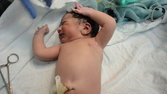 a child with cutting the umbilical string