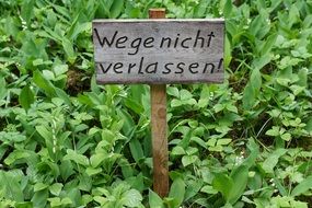 plate with a inscription on a green field