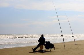 fishing man on the ocean beach