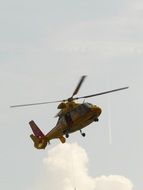 yellow helicopter in the sky