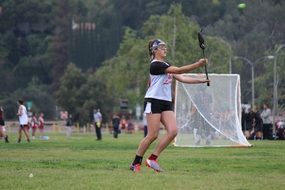 girl in lacrosse on the field