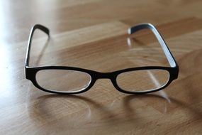 eyeglasses in black frame on table