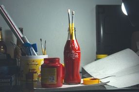brushes and supplies of a artist on the table