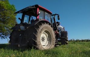 big wheels of a red tractor