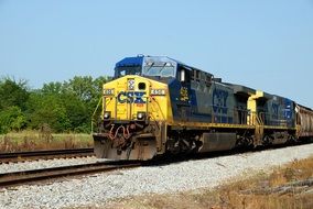 industrial yellow train on the railway