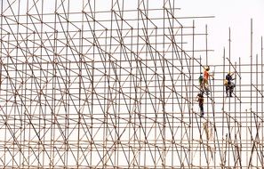 Workers on Scaffolding Construction