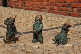 brass gnomes as sculptures in poland