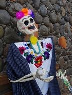 female Calaca at stone wall, Day Of The Dead festival, mexico, veracruz