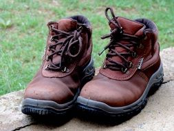 weathered male Boots outdoors near the grass