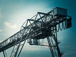 crane on sky background with clouds