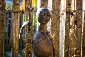 wooden sculpture near the fence