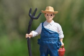 figure of a farmer in a yellow hat