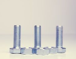 three screws with nuts