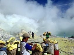 miners near the crater in indonesia