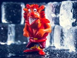 figure of a red devil with a grimace