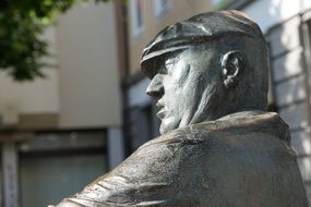 statue of a man in a cap