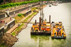 Dredgers working at rhine river embankment