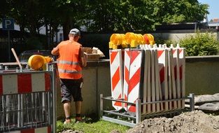 man in a safety vest on a building site