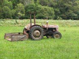 Old Tractor on green Field